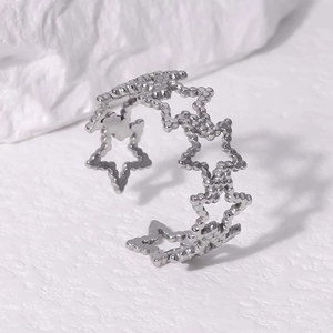 Macro view of adjustable silver pentagram star hollow ring made of polished steel