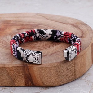 Men's titanium steel bracelet with skull engraving and patterned canvas fabric band