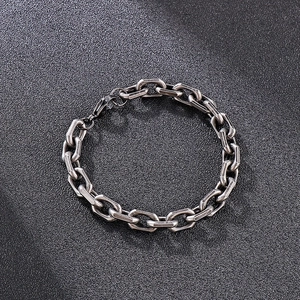 Detailed view of vintage silver steel chain bracelet with a sturdy lobster clasp