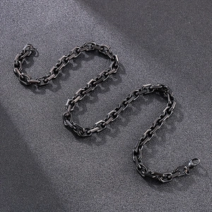 Detail of matte black stainless steel box chain with geometric beveled edges