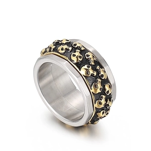 Gothic punk spinner ring for men featuring dual row golden skulls in silver titanium steel