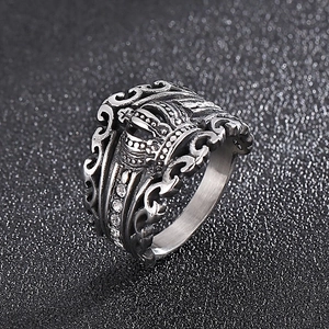 Detailed view of vintage silver crown ring with cubic zirconia and hollow out metal design