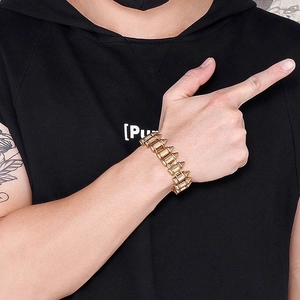 Men's gold bullet-link titanium steel bracelet on a male model's wrist