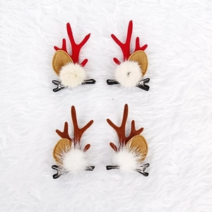 Cute Christmas reindeer antler hair clips set with festive bells and plush fur balls