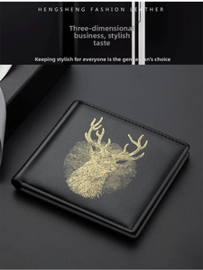 Close-up of black leather bifold wallet with golden stag emblem and premium stitching