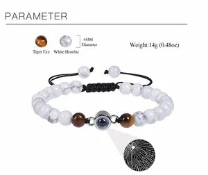 Detail of 6mm tiger eye and howlite beads with 100 languages projection stone