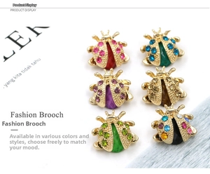 Set of six colorful beetle brooches with sparkling rhinestones and gold-plated finish