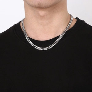 Silver cuban curb chain necklace in stainless steel shown on a male model neck