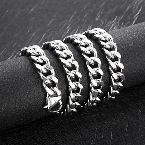 Close-up of 14mm thick silver Cuban chain necklace with polished stainless steel links