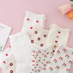Chic women's cotton crew socks with heart and cherry patterns on a pastel background