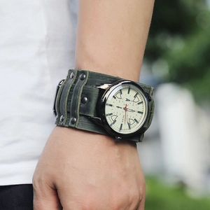 Retro punk style men's watch with wide green leather strap and metal rivet studs
