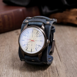 Detail of vintage blue-grey leather watch strap with metal rivets on wood background