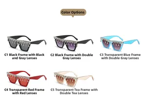 Détail de lunettes de soleil œil-de-chat de luxe avec des glands en strass