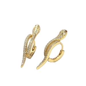 Sparkling gold snake hoop earrings with micro-paved crystals on white background