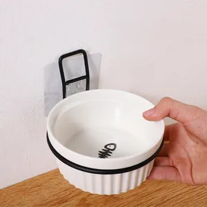 Wall-mounted white ceramic cat bowl with fishbone pattern and black metal bracket