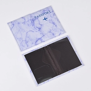Macro detail of marble pattern passport holder showing interior slots and cover