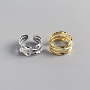 Detail view of 9.5mm wide layered wave rings with adjustable open band dimensions
