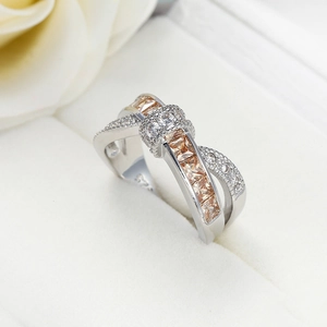 Macro view of S925 sterling silver criss cross ring with champagne zircon stones