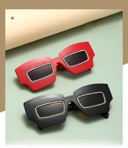 Detail of trendy rhinestone irregular square sunglasses with polarized grey lenses