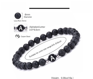 Macro shot of 6mm black lava rock beads and copper spacers on elastic alphabet bracelet