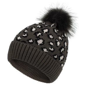 Detail of winter leopard knit beanie with thick ribbed cuff and faux fur pompom