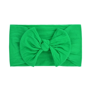 Soft emerald green nylon baby headband with a large handmade bow decoration