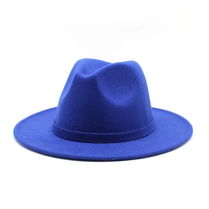 Macro shot of royal blue wool felt cowboy hat with classic pinched crown and band