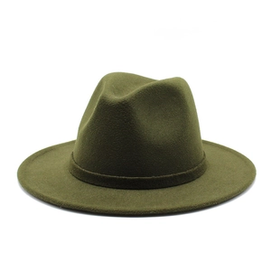 Close-up of olive green wool fedora hat showing textured wide brim and matching band