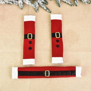 3-piece set of red Christmas refrigerator handle covers with gold buckles on burlap background