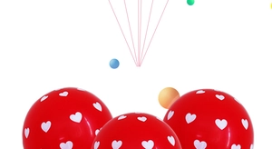 Close-up of red latex balloons with white heart prints for romantic wedding decoration