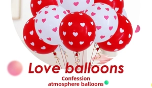 Detail of red and white heart print balloons with golden spiral ribbons for wedding decor