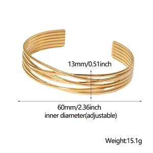 Detail view of gold wrap bracelet with 13mm width and 60mm adjustable inner diameter