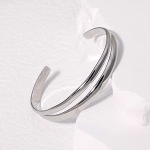 Minimalist silver stainless steel open bangle with a modern double-layer parallel design