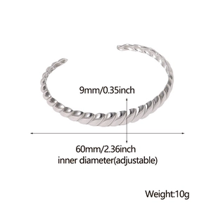 Detailed specs of 9mm wide silver twisted steel cuff showing adjustable inner diameter