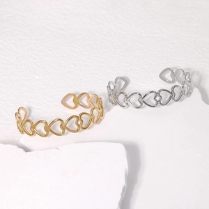Minimalist stainless steel open heart bracelet in polished gold and silver finishes