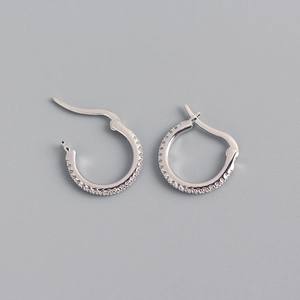 Detailed view of S925 sterling silver hoop earrings with dense cubic zirconia stones