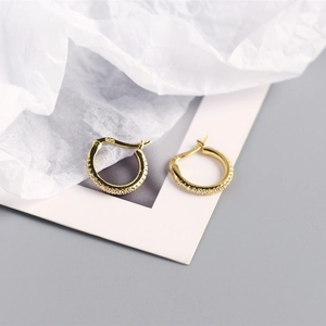 Detailed view of S925 sterling silver gold-plated hoop earrings with 925 hallmark stamp