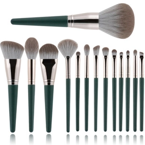 Detailed set of 14 professional dark green makeup brushes with soft synthetic bristles