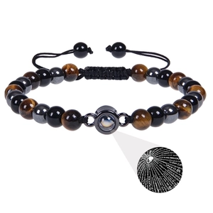 Close-up of adjustable bead bracelet with tiger eye stones and I Love You projection stone