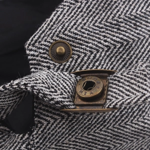 Classic black and white herringbone cotton beret with vintage bronze metal buckle detail