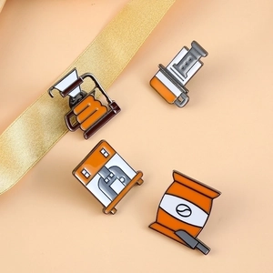 Set of four coffee culture enamel pins featuring coffee makers and beans in orange and white