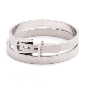 Detailed macro view of silver stainless steel cuff featuring Roman numeral engravings
