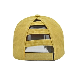 Detail of yellow washed cotton ponytail baseball cap with layered back opening and velcro strap