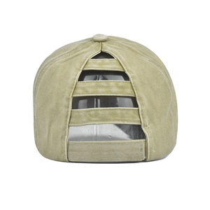 Detail of washed cotton ponytail baseball cap featuring elastic cross back and velcro strap