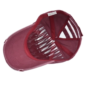 Detailed view of 100% cotton washed ponytail baseball cap with distressed brim and inner support