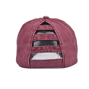 Detail of washed red ponytail baseball cap showing the multi-strap elastic back design