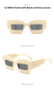 Detail of cream oversized sunglasses with crystal rhinestones and grey lenses