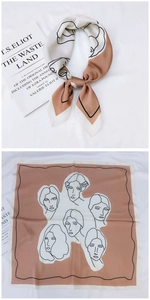 Detail of silk scarf with artistic face line drawing pattern and terracotta border