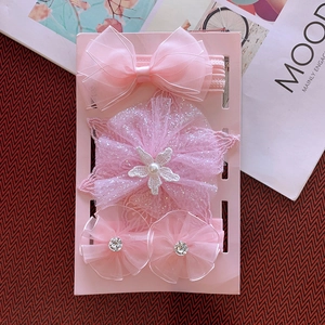 Detailed view of pink baby headbands with delicate lace flowers and sparkling rhinestones