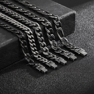 Various styles of black titanium steel Cuban and Figaro chains with jewelry clasps